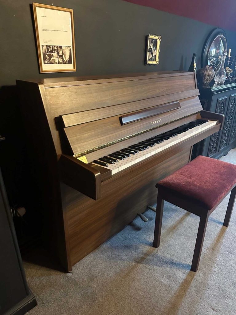 Yamaha upright piano owned by Oasis band member Paul Arthur
